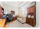 Office with built-in bookshelves and a bright sunny window at 245 Hull St, Henderson, NV 89015