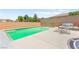 Sparkling pool and spa with lounge chairs in a private backyard oasis at 245 Hull St, Henderson, NV 89015
