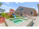 Relaxing spa with playset adjacent, situated on a grassy lawn at 245 Hull St, Henderson, NV 89015