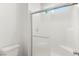 Modern bathroom featuring a glass shower with a bench and tiled walls at 2495 Sunflower Days Ave # 2052, North Las Vegas, NV 89031