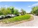 Well-maintained community park with walking path and trees at 2495 Sunflower Days Ave # 2052, North Las Vegas, NV 89031