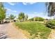 Community park with a grassy area and stone walking path at 2495 Sunflower Days Ave # 2052, North Las Vegas, NV 89031