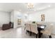 Elegant dining area with neutral decor, stylish lighting, and access to outdoor balcony at 2495 Sunflower Days Ave # 2052, North Las Vegas, NV 89031