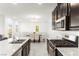 Bright, open kitchen featuring granite countertops, stainless steel appliances, and seamless flow to dining area at 2495 Sunflower Days Ave # 2052, North Las Vegas, NV 89031