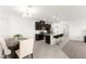 Modern kitchen and dining area offer stainless steel appliances and bar seating at 2495 Sunflower Days Ave # 2052, North Las Vegas, NV 89031