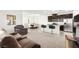 Open-concept living room flows seamlessly into the modern kitchen and dining area at 2495 Sunflower Days Ave # 2052, North Las Vegas, NV 89031