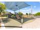 Community playground with shade structure and various play structures at 2495 Sunflower Days Ave # 2052, North Las Vegas, NV 89031