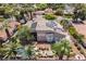Aerial view of home featuring a private pool, hot tub, solar panels and meticulously landscaped backyard at 2500 Wimbledon Dr, Las Vegas, NV 89107