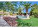 Lush backyard oasis with a pool, mature trees, and manicured landscaping at 2500 Wimbledon Dr, Las Vegas, NV 89107