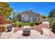 Serene backyard showcasing a hot tub, fire pit, and beautifully landscaped surroundings at 2500 Wimbledon Dr, Las Vegas, NV 89107