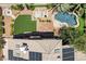 Aerial view of home featuring a pool, lounge area, hot tub, and well manicured landscaping at 2500 Wimbledon Dr, Las Vegas, NV 89107