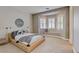 Bright bedroom featuring neutral decor, large windows with shutters, and carpet flooring at 2500 Wimbledon Dr, Las Vegas, NV 89107