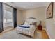 Cozy bedroom with hardwood floors, modern decor, and a large window for natural light at 2500 Wimbledon Dr, Las Vegas, NV 89107