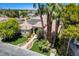 Aerial view of a home with solar panels, mature trees, landscaping, and inviting front entrance at 2500 Wimbledon Dr, Las Vegas, NV 89107