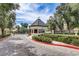 Community gatehouse with manicured landscaping and paved driveway at 2500 Wimbledon Dr, Las Vegas, NV 89107