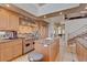 Open kitchen featuring stainless steel appliances, granite countertops, and custom cabinetry at 2500 Wimbledon Dr, Las Vegas, NV 89107