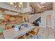 Spacious kitchen with granite countertops and a dining area underneath a high ceiling at 2500 Wimbledon Dr, Las Vegas, NV 89107
