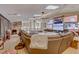 Spacious living room with multiple TVs, skylights, and comfortable seating at 2500 Wimbledon Dr, Las Vegas, NV 89107