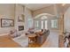 Inviting living room with fireplace, plush seating, and elegant French doors, perfect for relaxation and entertainment at 2500 Wimbledon Dr, Las Vegas, NV 89107