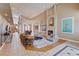 Spacious living room featuring high ceilings, an elegant fireplace, and stylish decor at 2500 Wimbledon Dr, Las Vegas, NV 89107