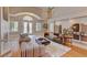 Open living room boasting high ceilings, a fireplace, and plenty of seating space at 2500 Wimbledon Dr, Las Vegas, NV 89107
