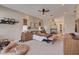 Spacious main bedroom with a fireplace, neutral tones, and comfortable furnishings at 2500 Wimbledon Dr, Las Vegas, NV 89107