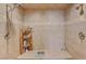 Walk-in shower with dual shower heads, tiled walls, and built-in shelving at 2500 Wimbledon Dr, Las Vegas, NV 89107