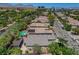 An aerial view of a home with a pool and solar panels in a well-developed community, highlighting the desert landscape at 2687 Ivoryhill St, Las Vegas, NV 89135