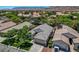 Aerial view of a residential home with a well-maintained roof, landscaping, and a two-car garage at 2687 Ivoryhill St, Las Vegas, NV 89135