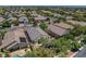 An aerial view showcases a single-story home with a pool and covered patio in a well-maintained community at 2687 Ivoryhill St, Las Vegas, NV 89135