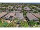A high aerial view captures a single-story residence nestled among lush trees in a peaceful neighborhood setting at 2687 Ivoryhill St, Las Vegas, NV 89135
