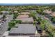 An aerial view of a single-story home with a patio cover in a vibrant neighborhood, showcasing lush landscaping at 2687 Ivoryhill St, Las Vegas, NV 89135