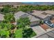 A clear aerial view shows a home with a well-maintained lawn and landscaping in a suburban neighborhood at 2687 Ivoryhill St, Las Vegas, NV 89135