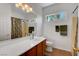 Bright bathroom with tile floors, a large mirror, and a decorative shower curtain at 2687 Ivoryhill St, Las Vegas, NV 89135