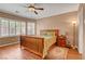 Bedroom with wood floors, a ceiling fan, and lots of natural light at 2687 Ivoryhill St, Las Vegas, NV 89135