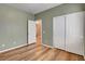 Comfortable bedroom with hardwood floors, double closet, and neutral paint at 2687 Ivoryhill St, Las Vegas, NV 89135