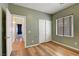 Inviting bedroom with hardwood floors, closet, and window with blinds at 2687 Ivoryhill St, Las Vegas, NV 89135