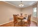 Inviting dining room with hardwood floors, neutral walls, and a modern chandelier at 2687 Ivoryhill St, Las Vegas, NV 89135