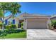 Charming single-story home featuring desert landscaping, blue shutters, and a two-car garage at 2687 Ivoryhill St, Las Vegas, NV 89135
