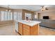 Bright kitchen island with double sink adjacent to open-concept living room at 2687 Ivoryhill St, Las Vegas, NV 89135