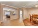 Open-concept living space with tile and hardwood flooring, showcasing natural light and modern finishes at 2687 Ivoryhill St, Las Vegas, NV 89135