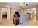 Living room with tile floors, view to bedroom and dining area at 2687 Ivoryhill St, Las Vegas, NV 89135