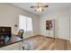Bright office space with wood floors, white trim, and a ceiling fan for comfortable work from home environment at 2687 Ivoryhill St, Las Vegas, NV 89135