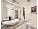 Modern bathroom featuring vanity sink with granite countertop and updated tile in shower at 2725 S Nellis Blvd # 2084, Las Vegas, NV 89121