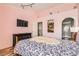 Comfortable bedroom with a TV, ensuite bathroom, walk-in closet, and unique color palette at 2725 S Nellis Blvd # 2084, Las Vegas, NV 89121