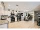 Updated kitchen features granite counters, modern appliances, and adjacent dining area at 2725 S Nellis Blvd # 2084, Las Vegas, NV 89121