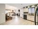 Open-concept living space with wood floors, fireplace, and natural light from large windows at 2725 S Nellis Blvd # 2084, Las Vegas, NV 89121