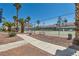 Community tennis court with well-maintained surface and surrounding landscape for active recreation at 2725 S Nellis Blvd # 2084, Las Vegas, NV 89121