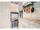 Organized utility room with water filtration system and storage cabinets at 2725 S Nellis Blvd # 2084, Las Vegas, NV 89121