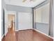 This bedroom features wood floors, a ceiling fan, and a window that brings in natural light at 2864 Kinknockie Way, Henderson, NV 89044